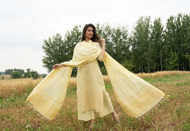 Woman wearing a straight-cut ethnic suit styled to create a slim and elegant look